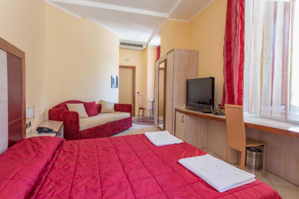 Postel nebo postele na pokoji v ubytování Hotel Conte Ruggero