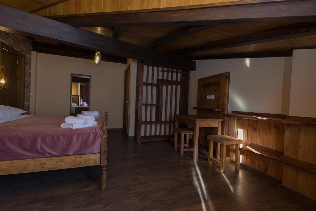 Postel nebo postele na pokoji v ubytování Hotel Mansarda Mestia