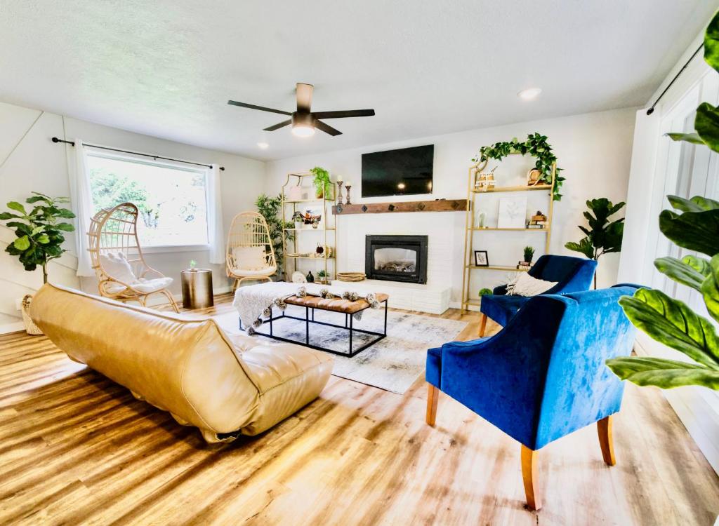a living room with a couch and a fireplace at Modern Boho Retreat in Corvallis