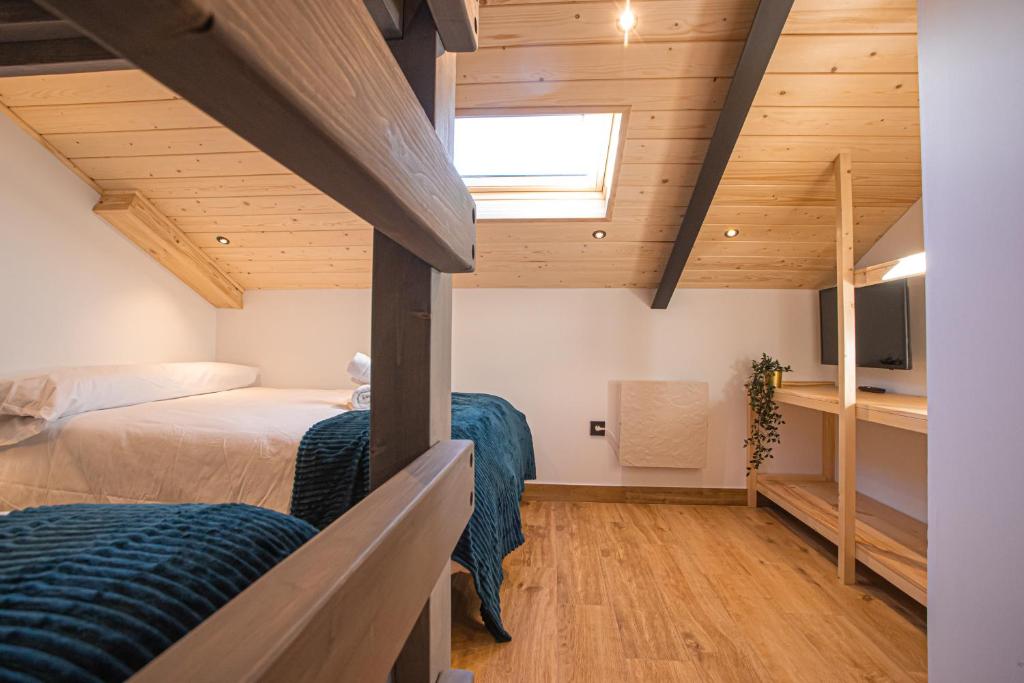 Posteľ alebo postele v izbe v ubytovaní APARTAMENTO BLOSSOM