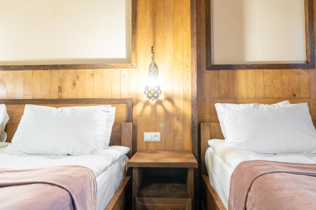 Postel nebo postele na pokoji v ubytování Hotel Mansarda Mestia