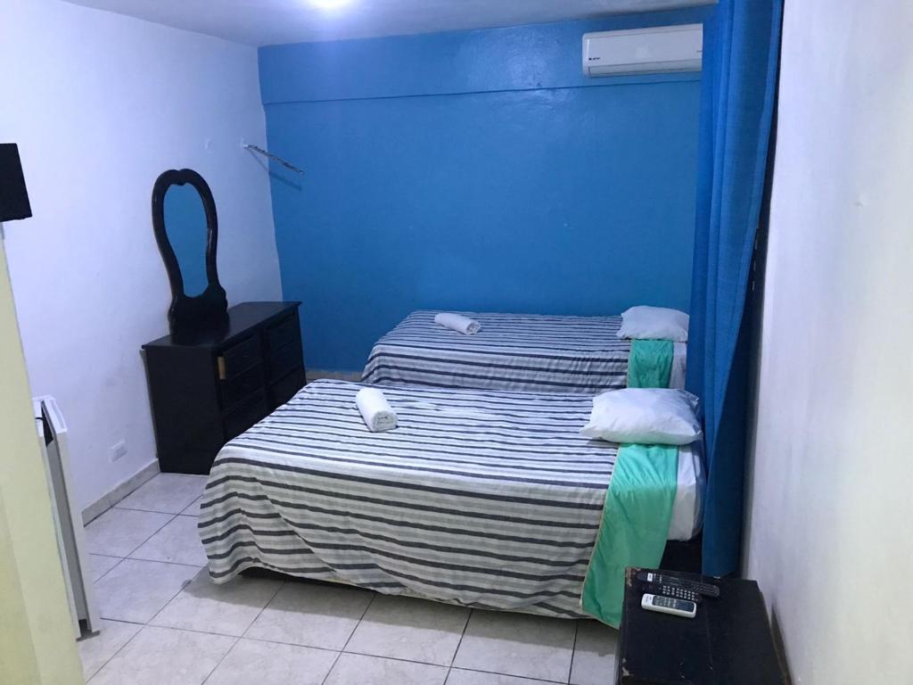 Postel nebo postele na pokoji v ubytování Hostal Magisterial Santo Domingo
