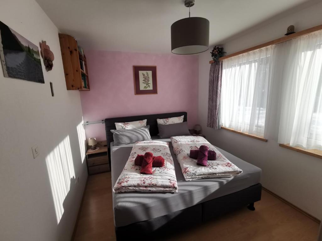 Postel nebo postele na pokoji v ubytování Ferienwohnung Aquileia