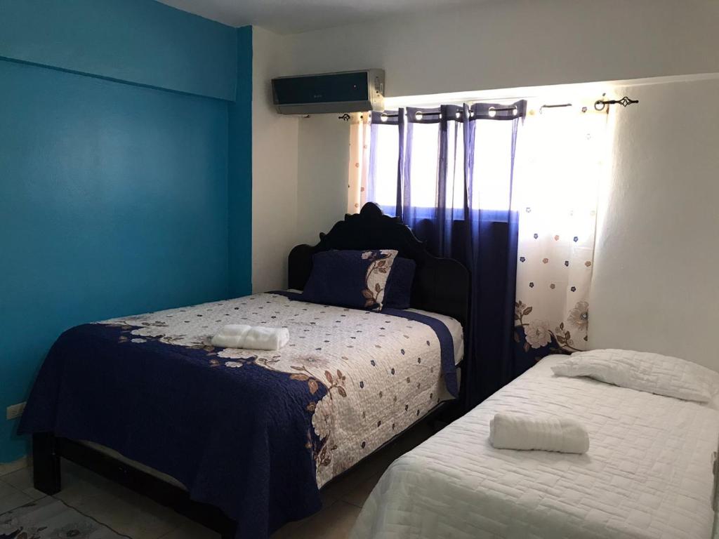 Postel nebo postele na pokoji v ubytování Hostal Magisterial Santo Domingo