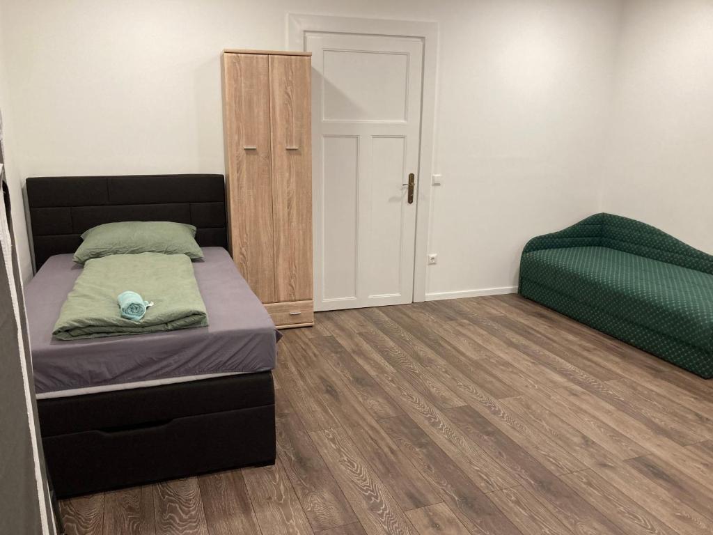 Posteľ alebo postele v izbe v ubytovaní Roland Apartment Zuglo 2