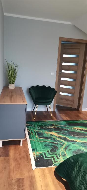 Część wypoczynkowa w obiekcie Apartamenty Green&Blue w Węgorzewie- GREEN