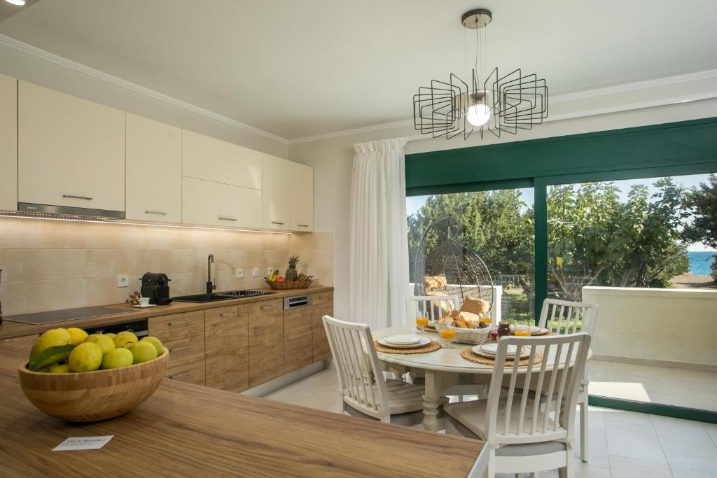 A kitchen or kitchenette at Beachfront Villa SeaShell Superior