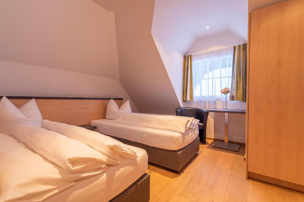 Posteľ alebo postele v izbe v ubytovaní Hotel Garni Martina
