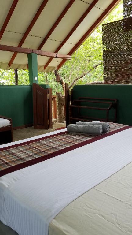 Postel nebo postele na pokoji v ubytování Sigiri Holiday Villa