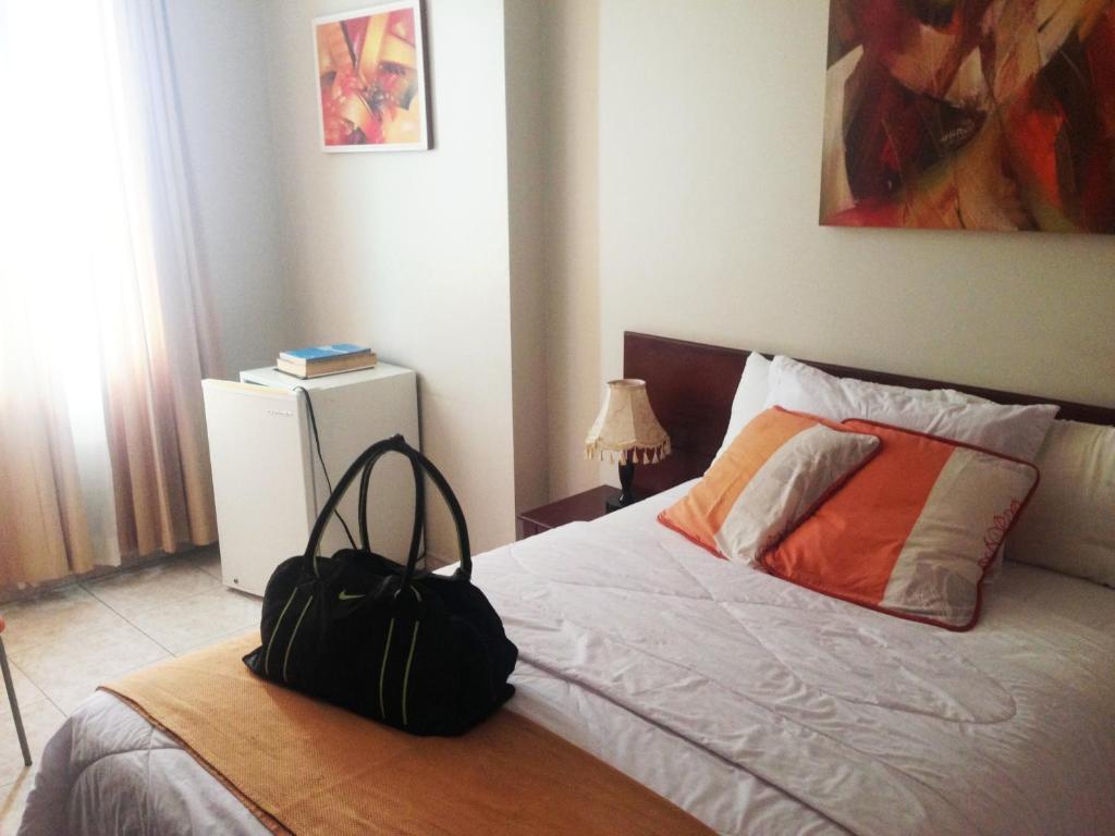 Postel nebo postele na pokoji v ubytování Hotel Air Suites