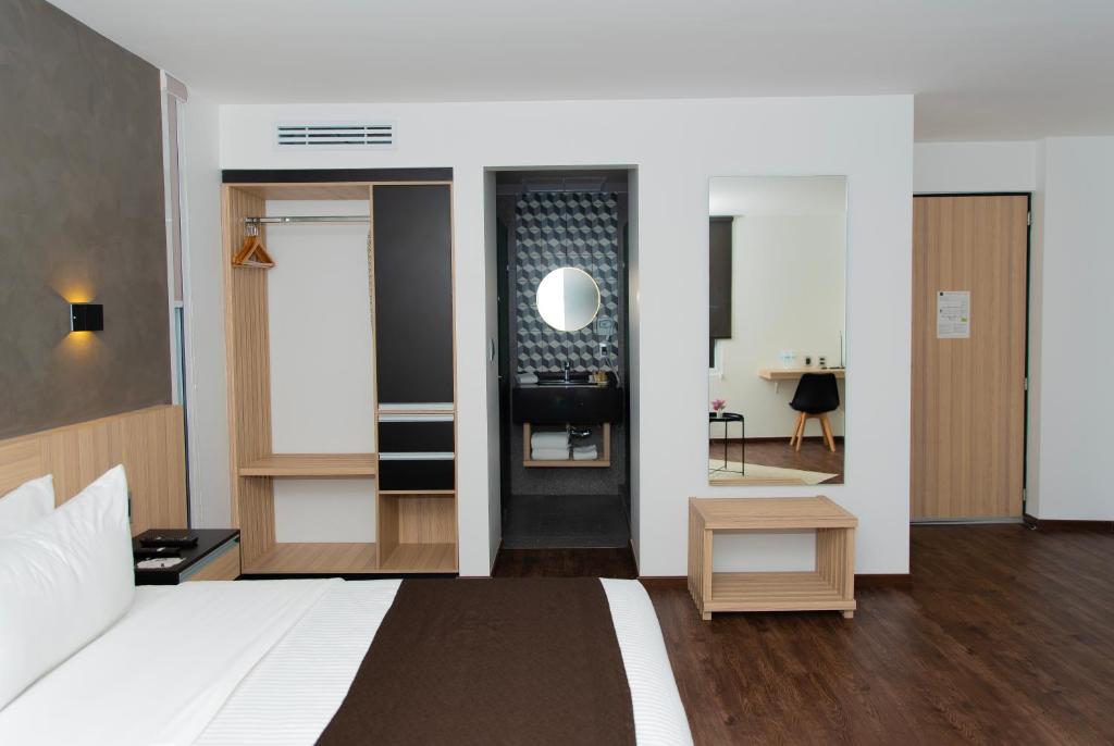 Postel nebo postele na pokoji v ubytování Fato Hotel