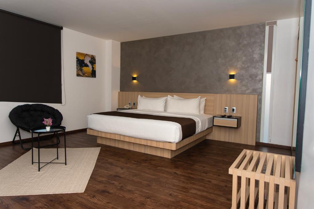 Postel nebo postele na pokoji v ubytování Fato Hotel