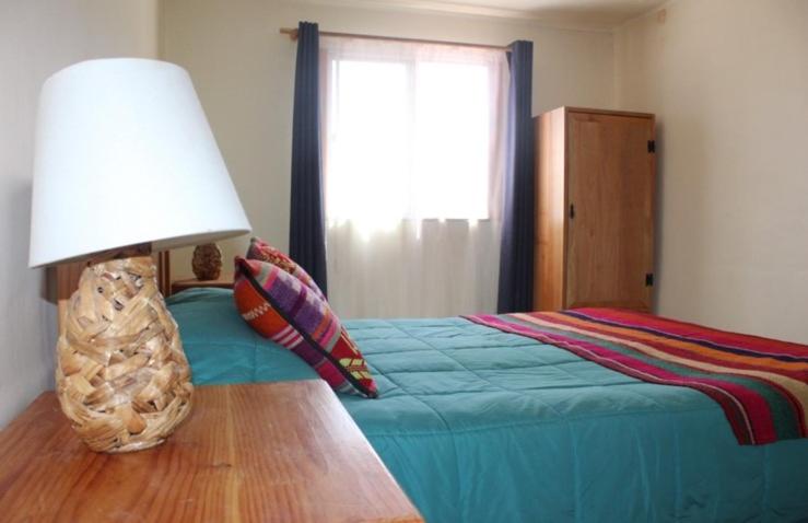 Postel nebo postele na pokoji v ubytování Hostal Ayni