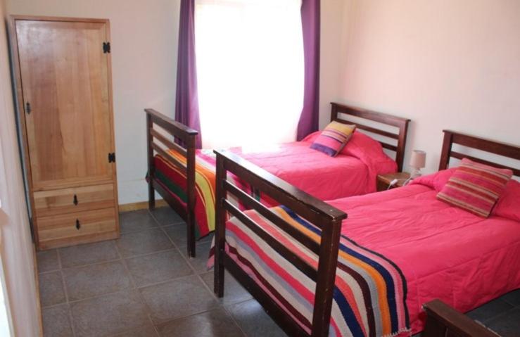 Postel nebo postele na pokoji v ubytování Hostal Ayni
