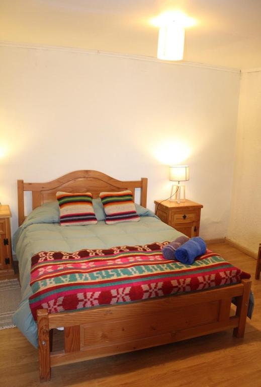 Postel nebo postele na pokoji v ubytování Hostal Ayni