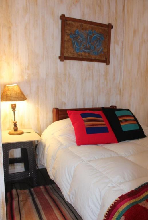 Postel nebo postele na pokoji v ubytování Hostal Ayni