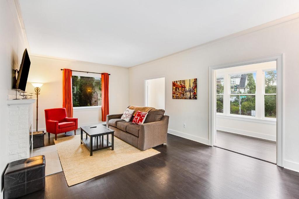 a living room with a couch and a chair at The Colonial in Seattle