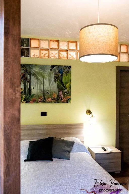 A bed or beds in a room at Camera il Nido