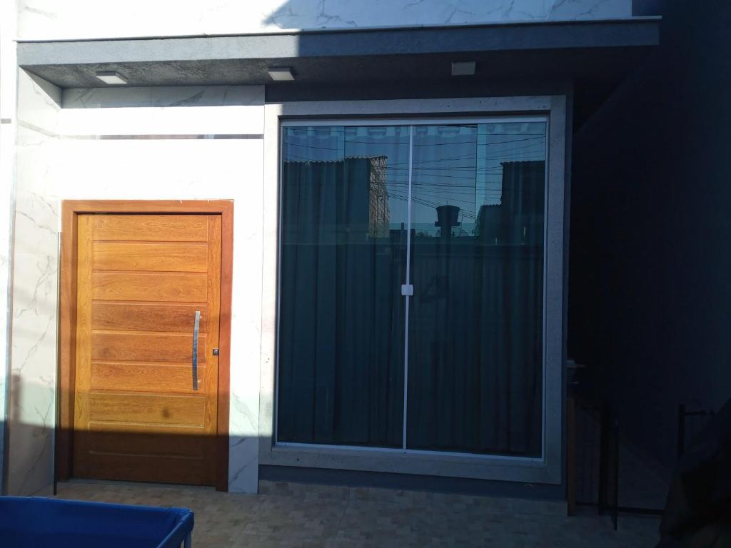 a sliding glass door of a house at casa da paz in Porto Seguro
