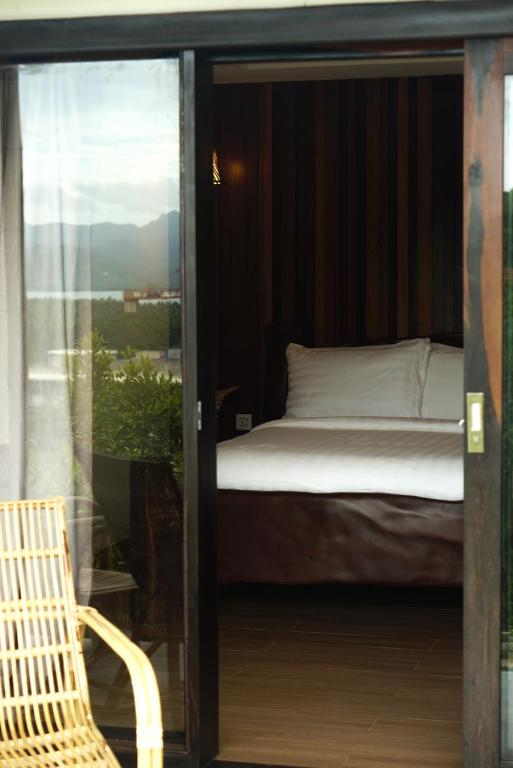 Postel nebo postele na pokoji v ubytování El Nido Bayview Resort