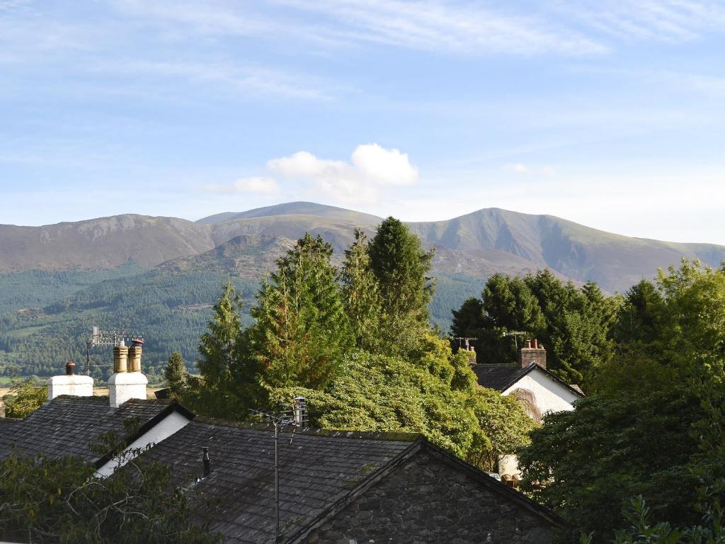 a view of mountains from roofs of houses at Fairholme in Braithwaite