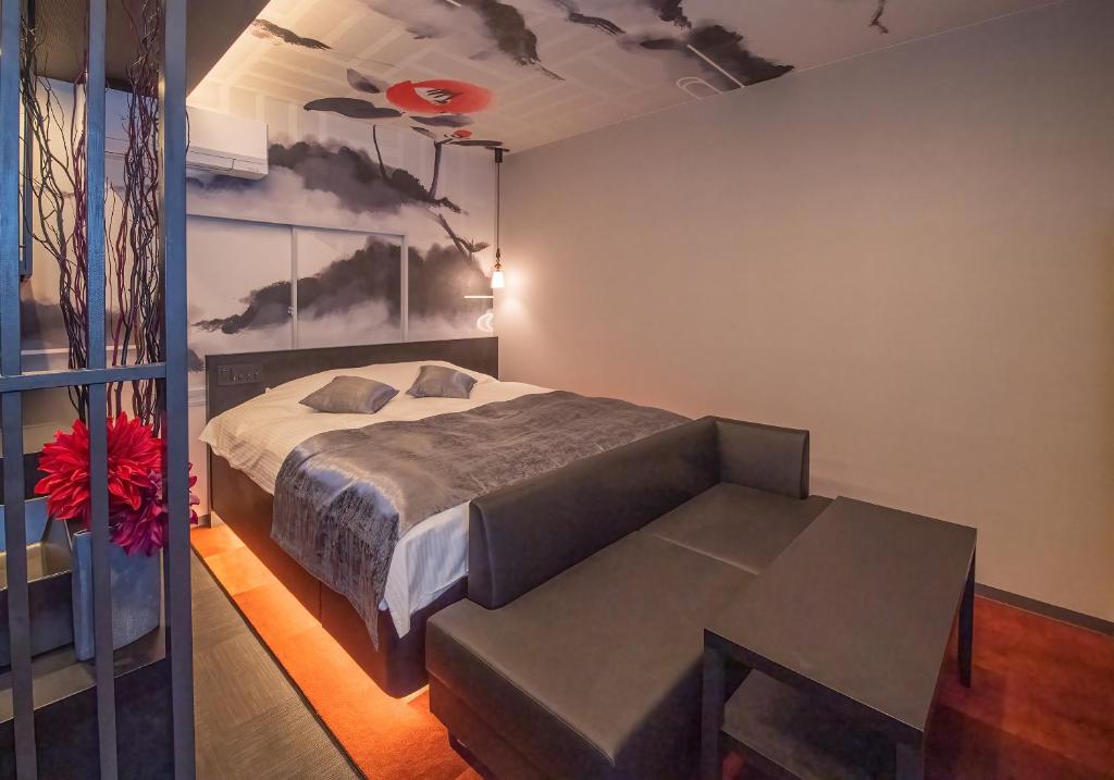 Postel nebo postele na pokoji v ubytování Hotel Kaguya