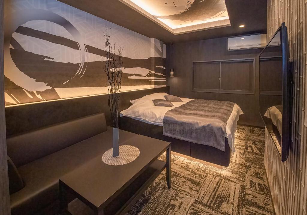 Postel nebo postele na pokoji v ubytování Hotel Kaguya