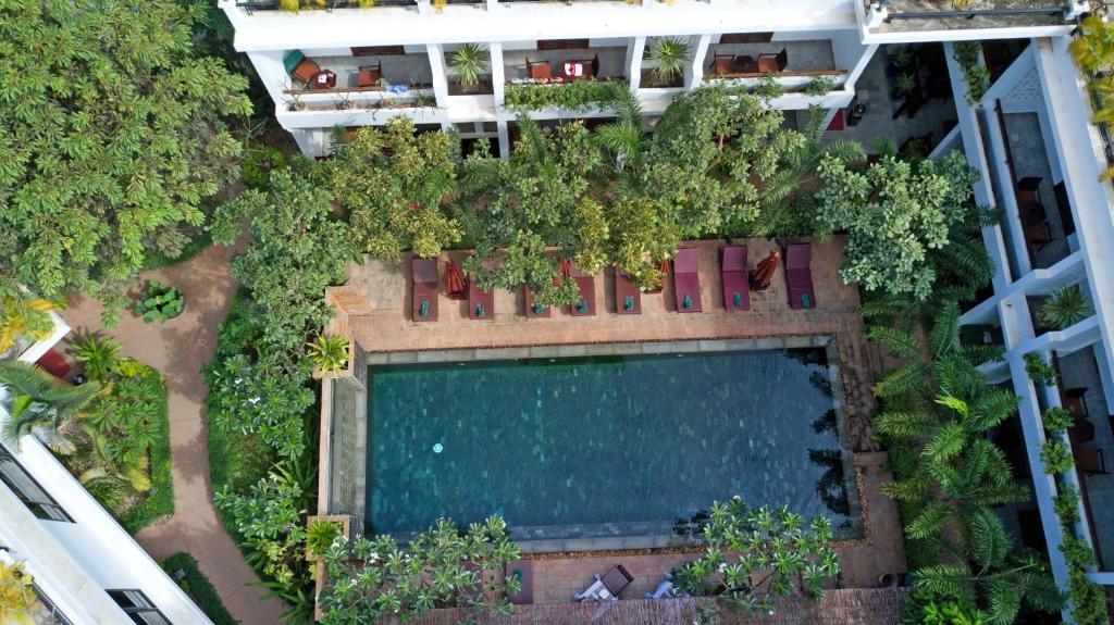 an overhead view of a swimming pool in a resort at The Moon Residence & Spa in Siem Reap