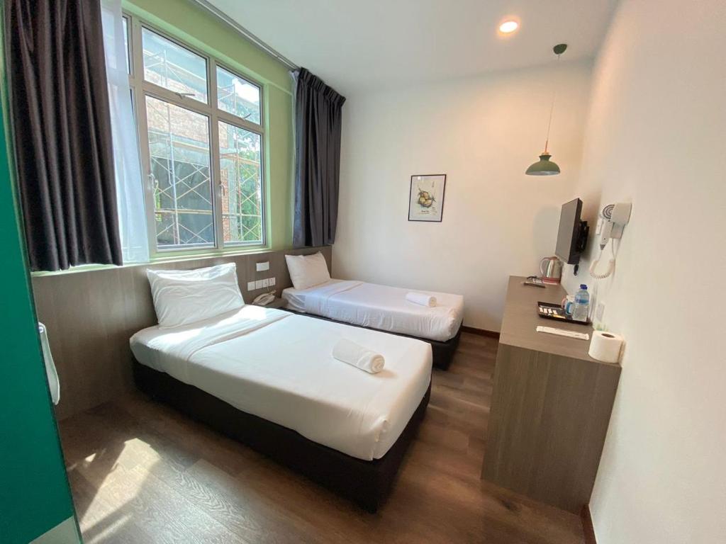 Postel nebo postele na pokoji v ubytování BENUTTEN 99 HOTEL