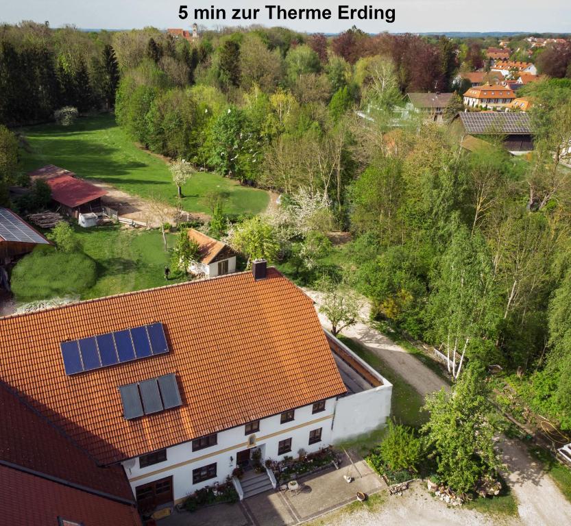 an aerial view of a house with solar panels on the roof at Döllelhof Erding in Erding
