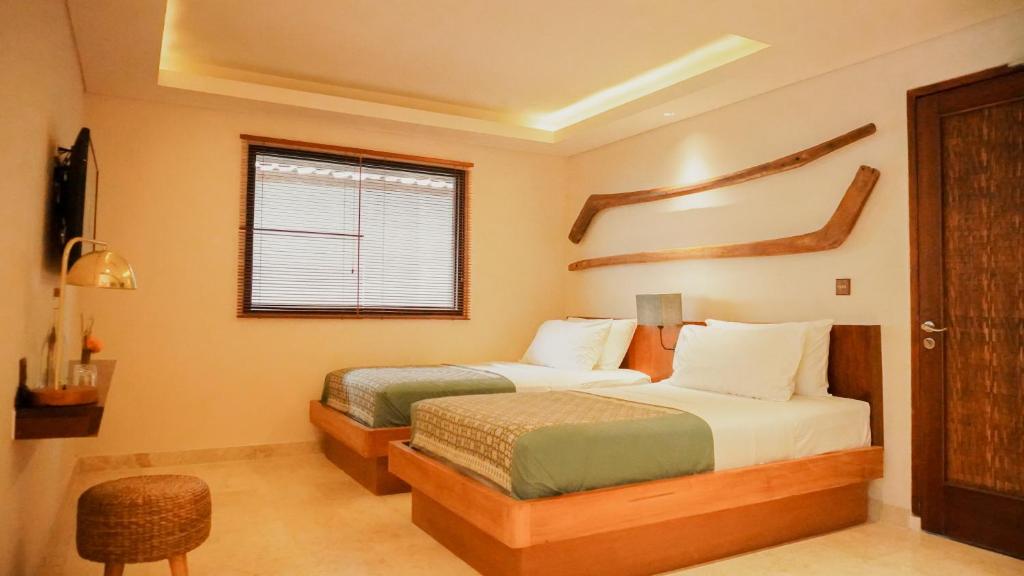 Postel nebo postele na pokoji v ubytování Annora Villas Seminyak