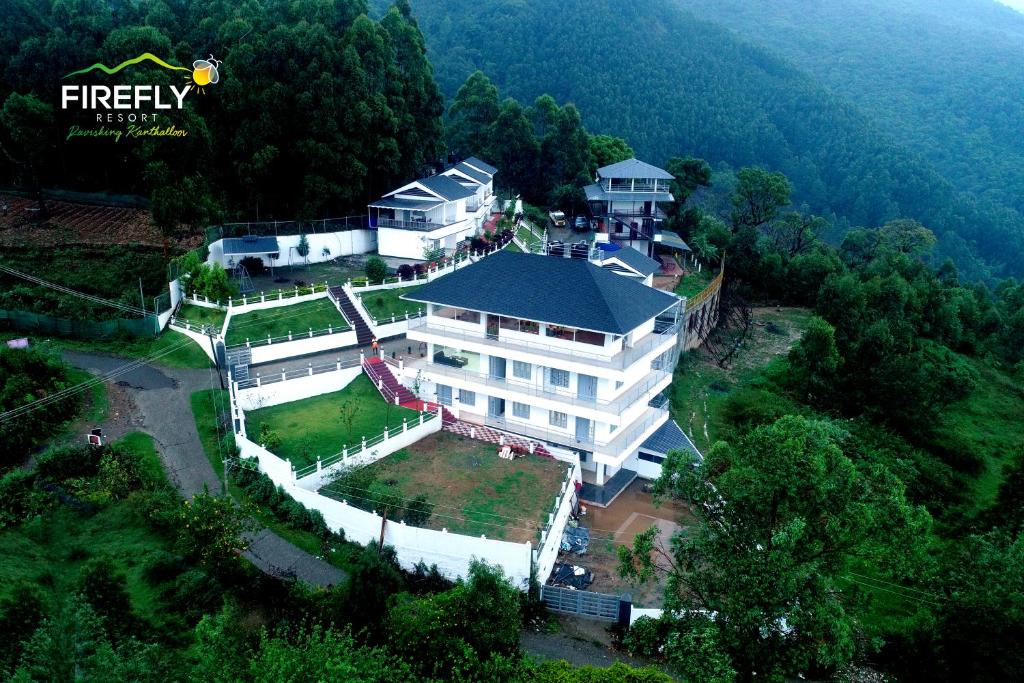 an aerial view of a large white building at Firefly Resort in Kanthalloor