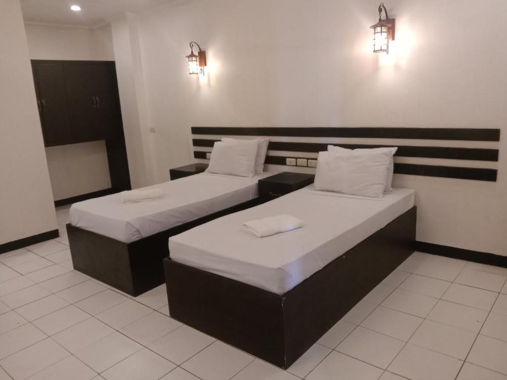 Postel nebo postele na pokoji v ubytování Hotel Benjamin Naval