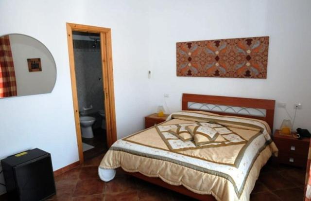 Postel nebo postele na pokoji v ubytování Hotel California