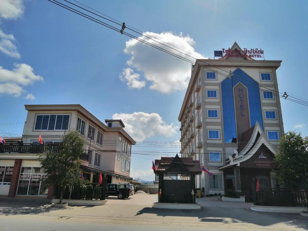 a group of buildings on a city street at Favanhmai Hotel in Muang Phônsavan