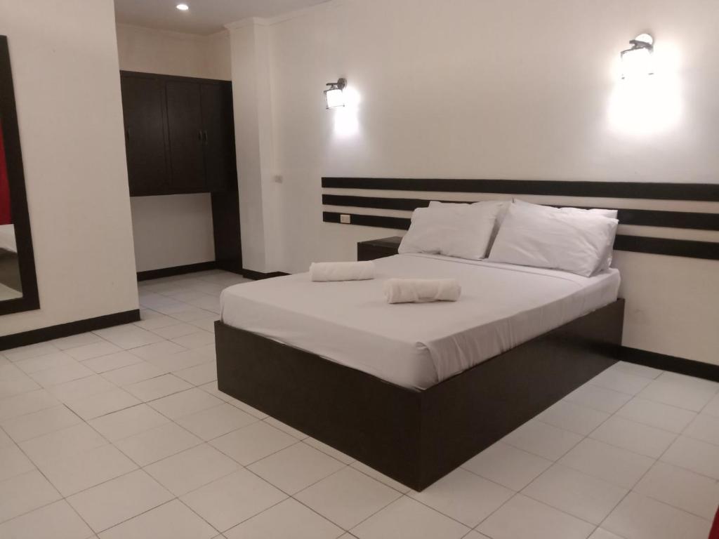 Postel nebo postele na pokoji v ubytování Hotel Benjamin Naval