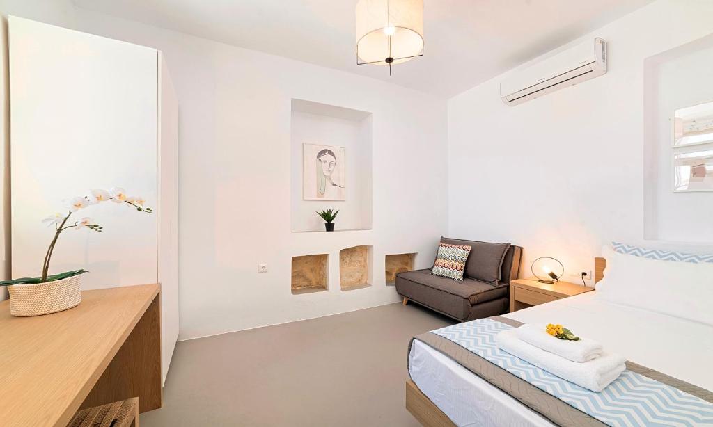 Postel nebo postele na pokoji v ubytování Sun Stone Villas