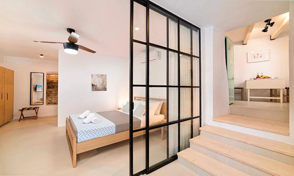 Postel nebo postele na pokoji v ubytování Sun Stone Villas