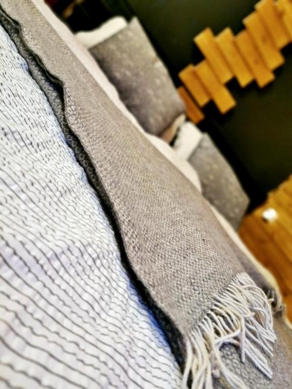 A bed or beds in a room at Tölgyes Menedék