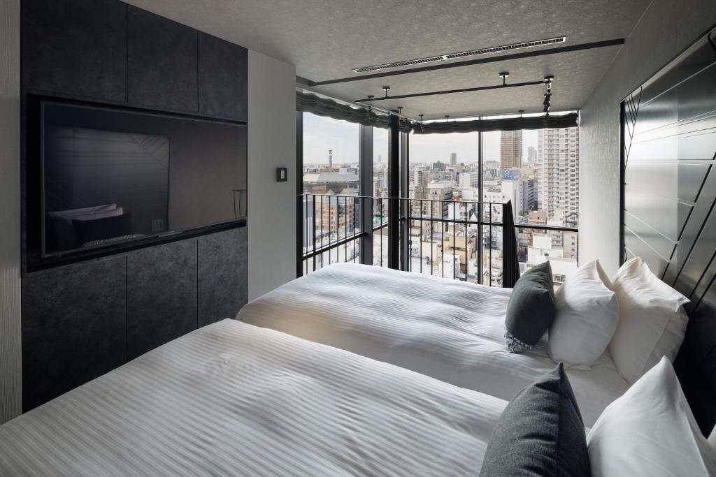 Ein Bett oder Betten in einem Zimmer der Unterkunft Mercure Tokyu Stay Osaka Namba