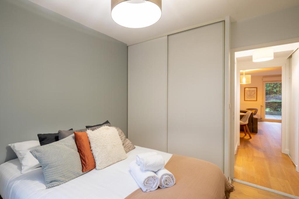 Łóżko lub łóżka w pokoju w obiekcie Sérénité - 2 chambres - Calme et Verdure