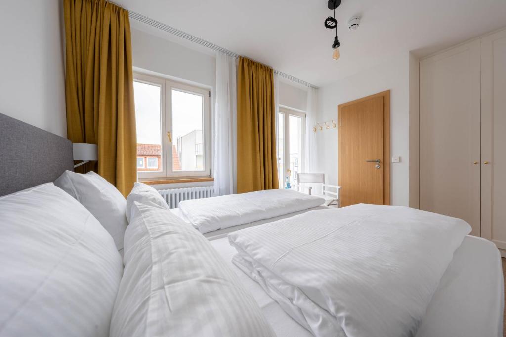 Postel nebo postele na pokoji v ubytování Logierhaus am Rathaus