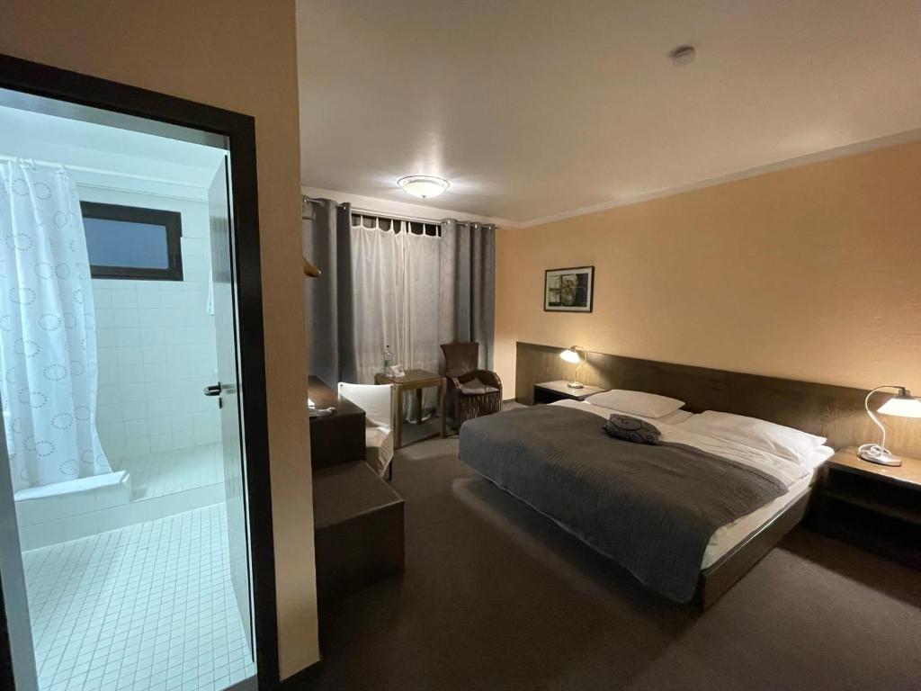 Postel nebo postele na pokoji v ubytování Hotel Brunnenhof