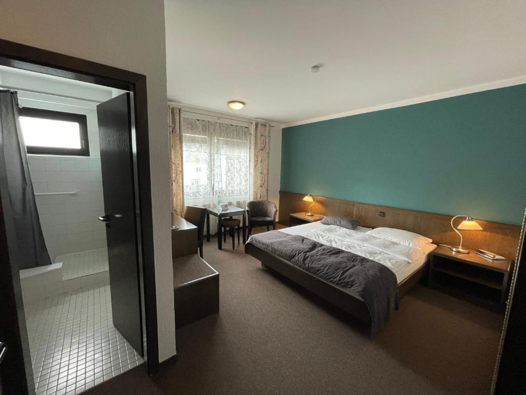 Postel nebo postele na pokoji v ubytování Hotel Brunnenhof