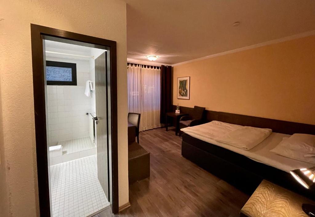 Postel nebo postele na pokoji v ubytování Hotel Brunnenhof
