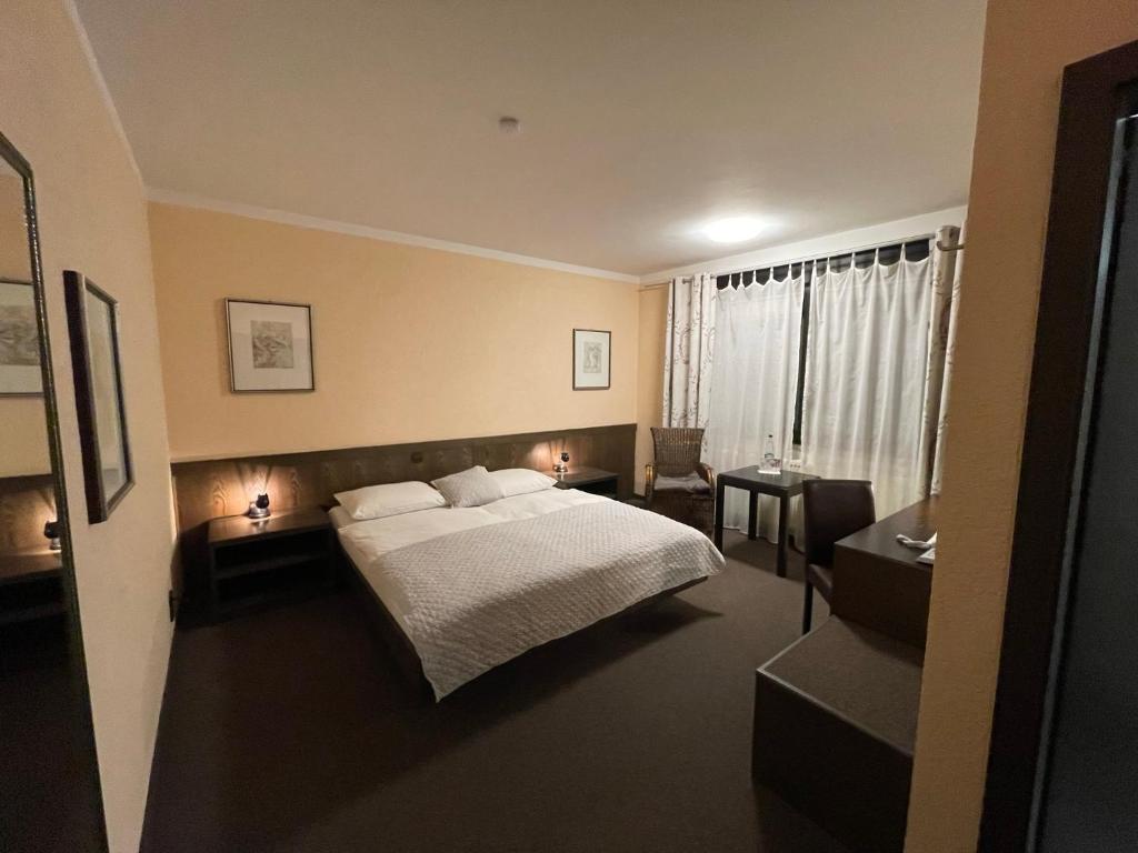 Postel nebo postele na pokoji v ubytování Hotel Brunnenhof