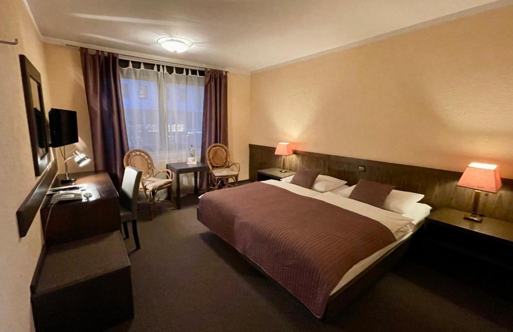 Postel nebo postele na pokoji v ubytování Hotel Brunnenhof