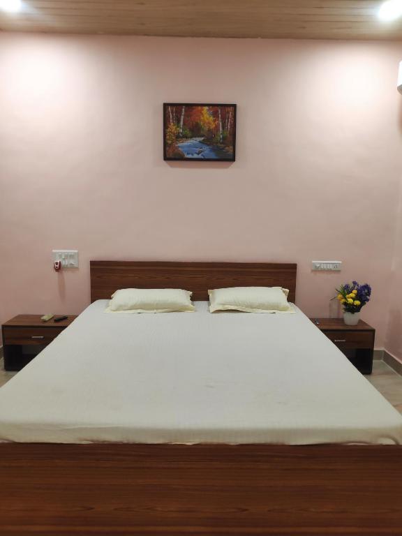 Postel nebo postele na pokoji v ubytování Soham Beach Resort, Diveagar