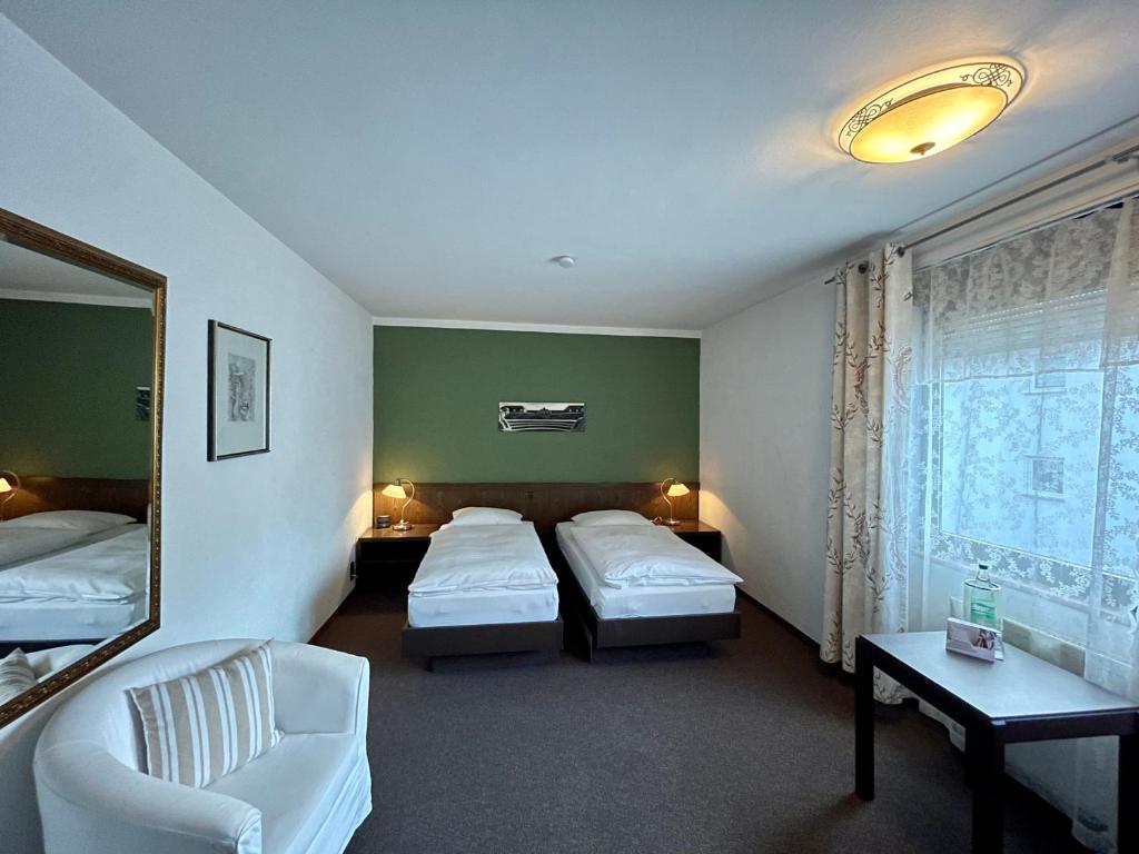 Postel nebo postele na pokoji v ubytování Hotel Brunnenhof