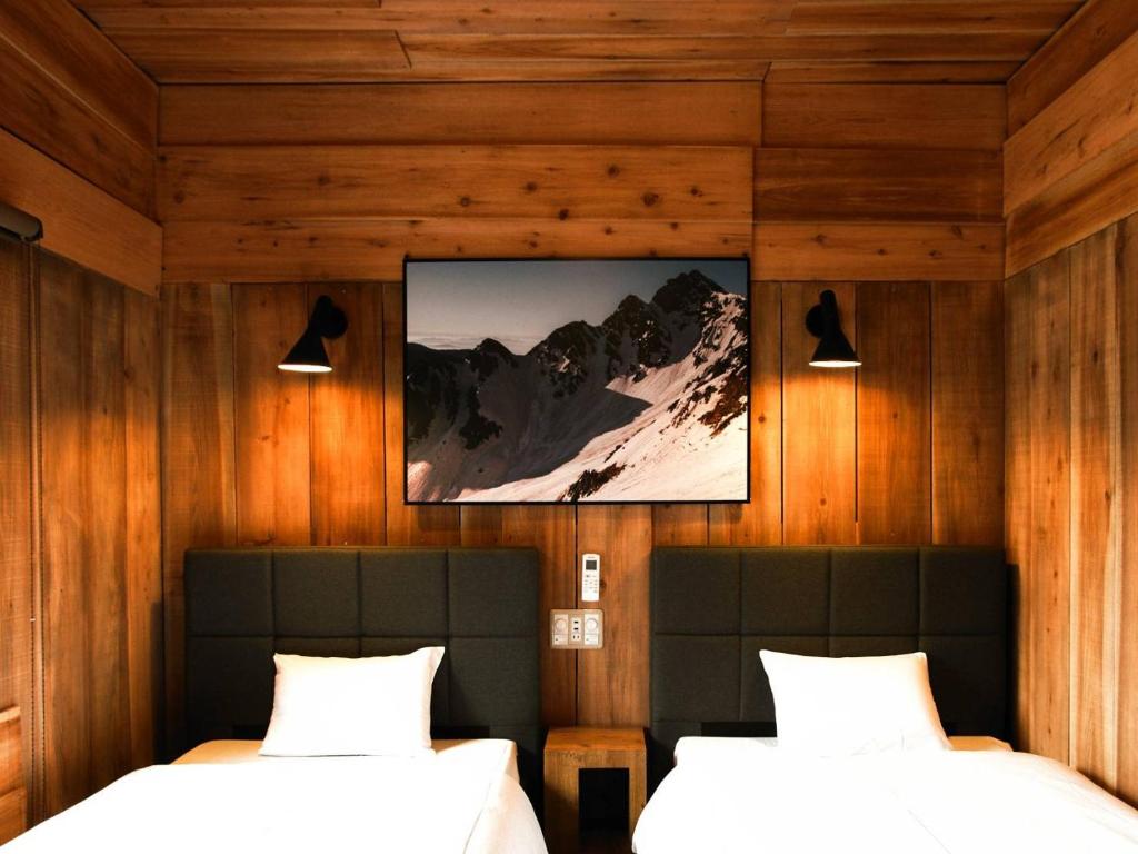Postel nebo postele na pokoji v ubytování Guesthouse Shimashima